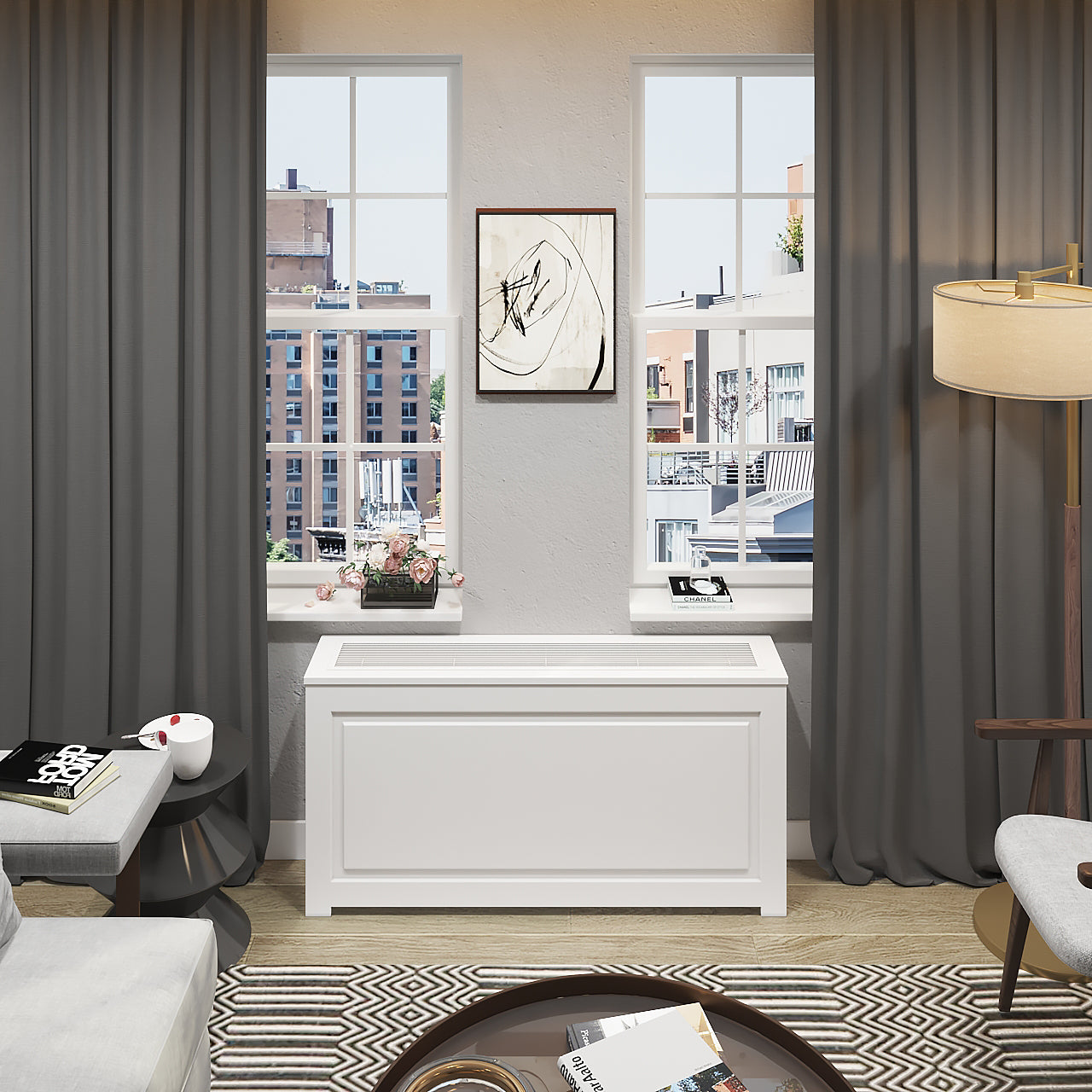 Custom PTAC HVAC cover NYC with white metal grille, precision-fit in modern apartment living room between two windows with gray curtains.