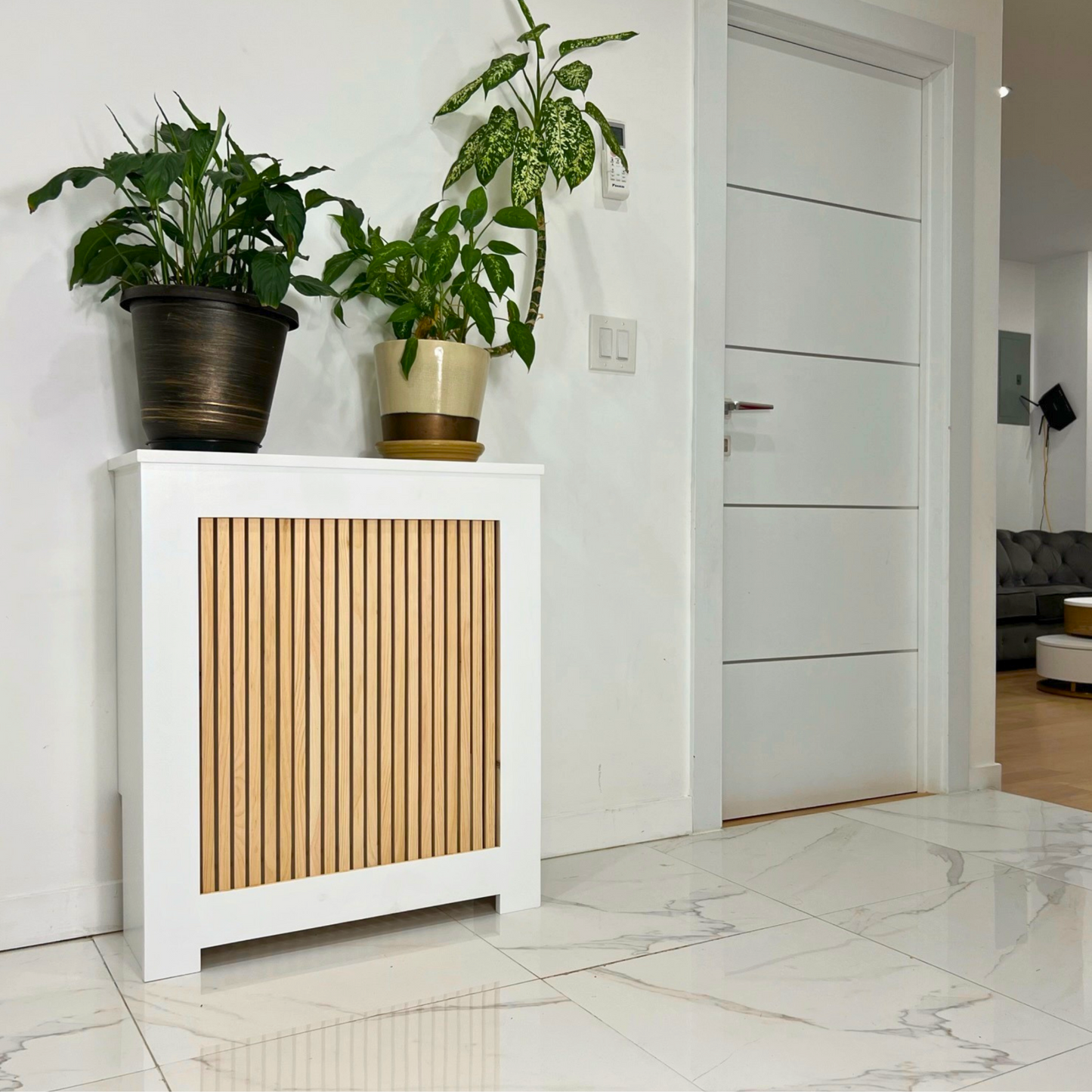 What are the benefits of using radiator covers in home decor? How can radiator covers enhance heating efficiency? What materials are commonly used in radiator cover construction? Are there customizable options for radiator covers? Can radiator covers be painted or stained to match room decor? Are radiator covers easy to install and maintain? Are there safety considerations when using radiator covers?