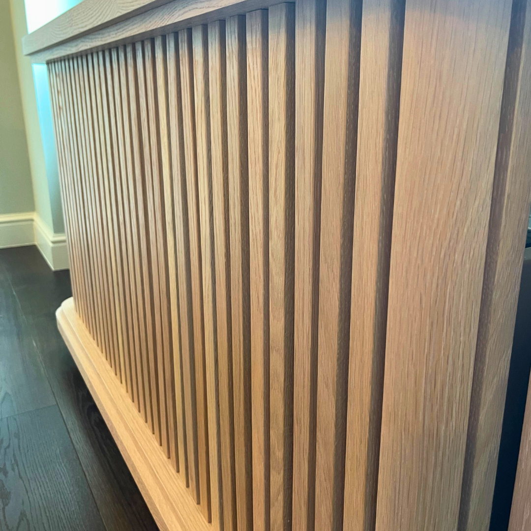Close-up of natural oak wood grain on custom radiator heat cover cabinet