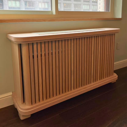 Custom oak radiator cover cabinet with natural wood grain and furniture-grade finish