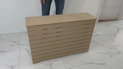 Slatted-style unfinished radiator cover in MDF, displayed in modern tiled room, ideal for DIY painting and NYC apartments.