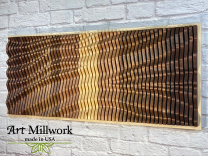 Close-up of VORTEX acoustic wood wall panel on white brick wall, highlighting handcrafted 3D wood wave patterns by Art Millwork USA.