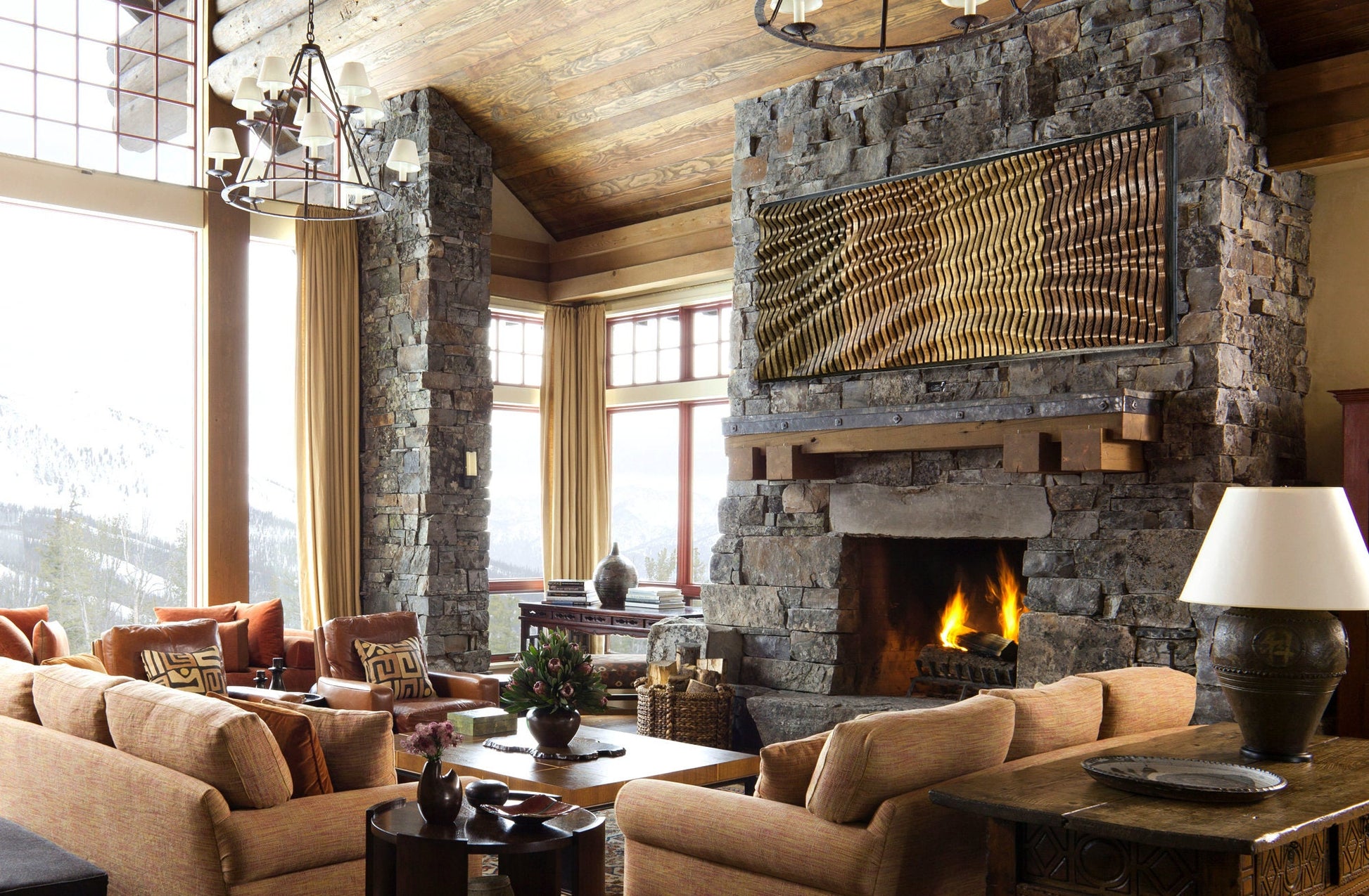 Rustic living room with stone fireplace featuring TRAVERSO Wood Wall Art - Parametric Wood Acoustic Panel | Handmade NYC as a sculptural focal point.