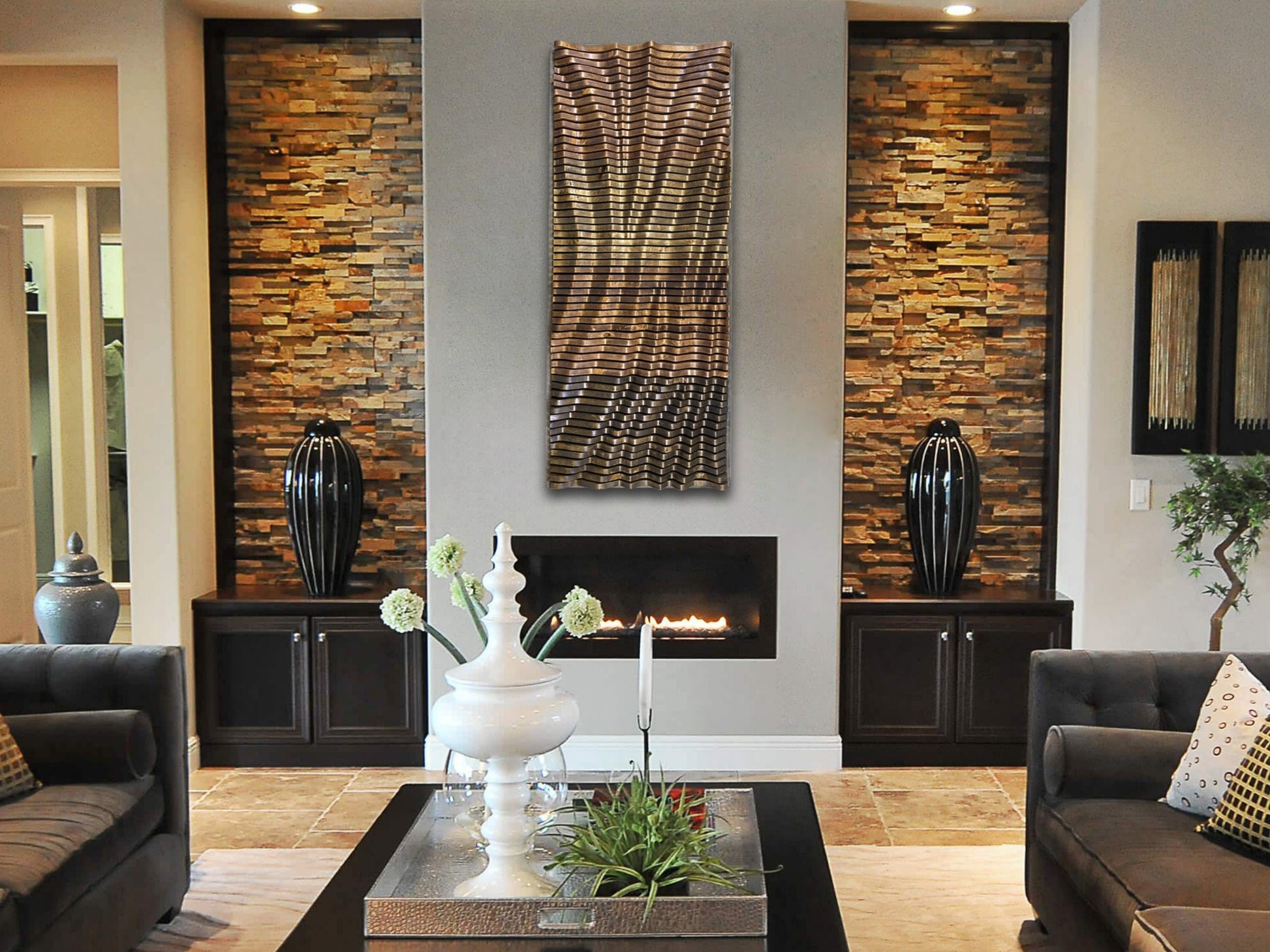 Vertical installation of TRAVERSO Wood Wall Art - Parametric Wood Acoustic Panel | Handmade NYC in elegant living room with stone accent walls.